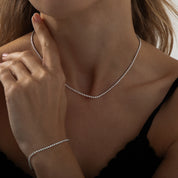 Silver dainty tennis necklace with round-cut cubic zirconia stones on a delicate chain