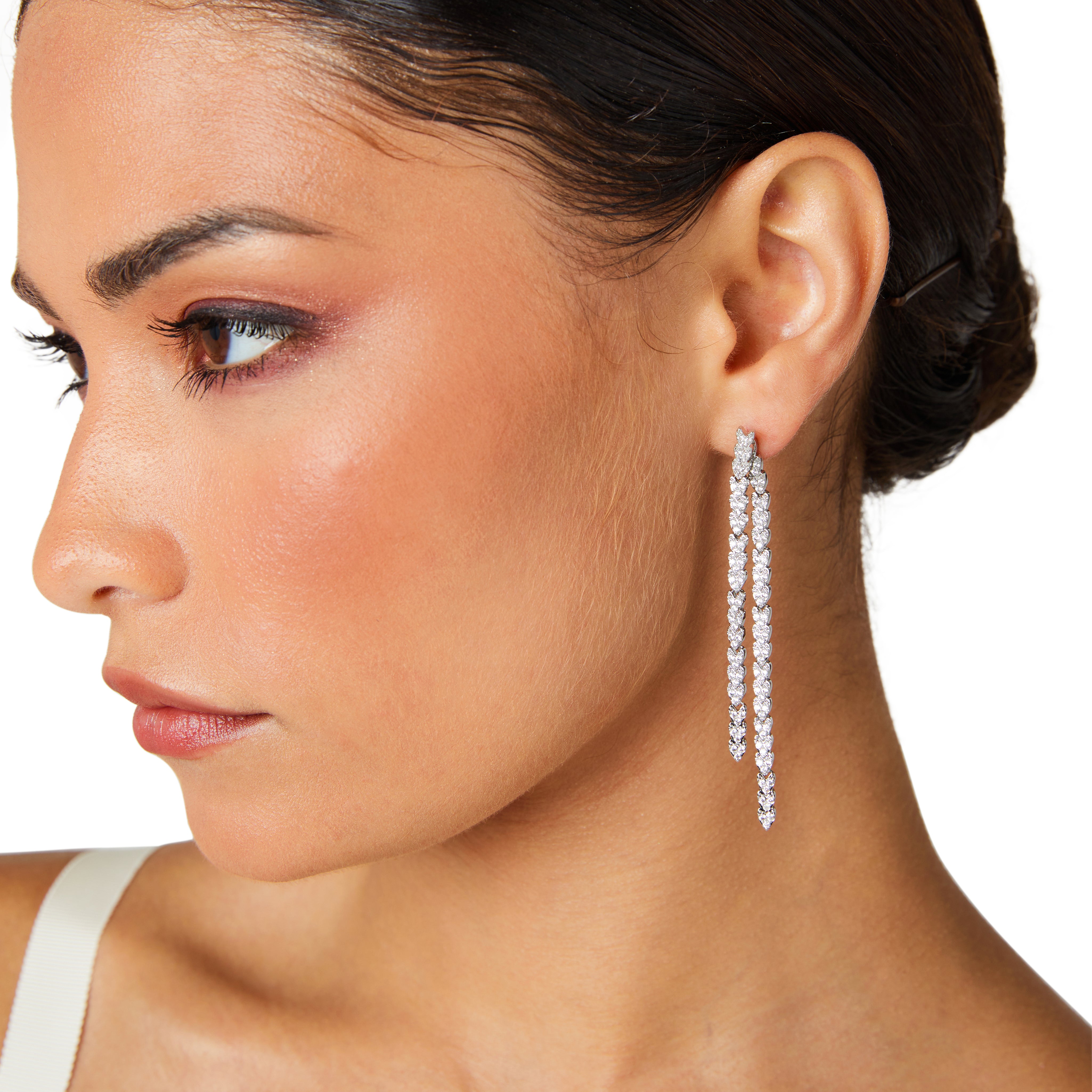 Model wearing silver waterfall front-to-back drop earrings, showcasing elegant layered cascade effect