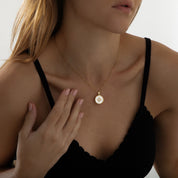 Gold pendant necklace featuring a polished star charm on a fine chain, part of the Illuminate Collection by Valentina Rose.