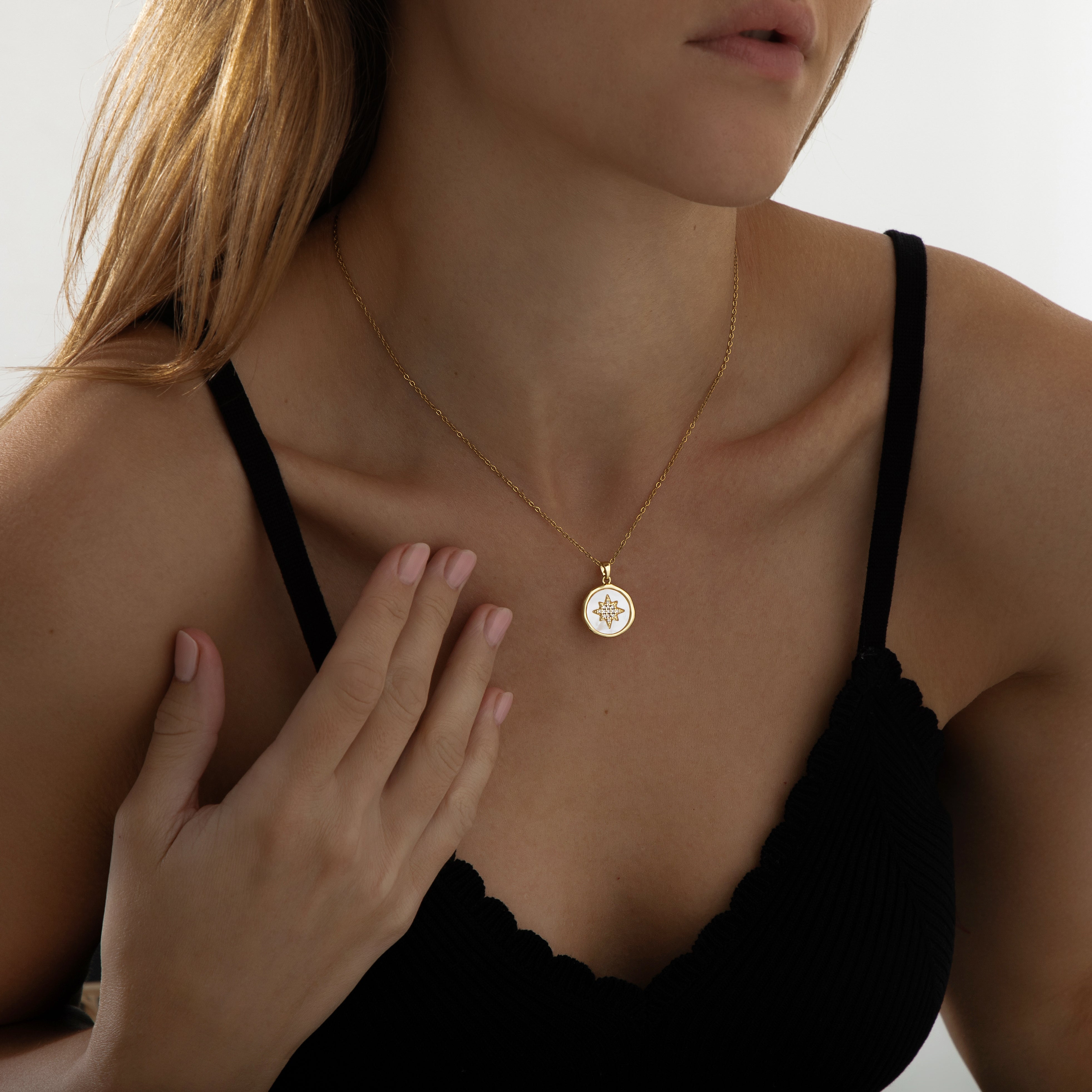 Gold pendant necklace featuring a polished star charm on a fine chain, part of the Illuminate Collection by Valentina Rose.