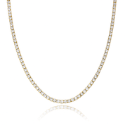 Gold dainty tennis necklace featuring a continuous line of sparkling round-cut cubic zirconia stones on a delicate chain