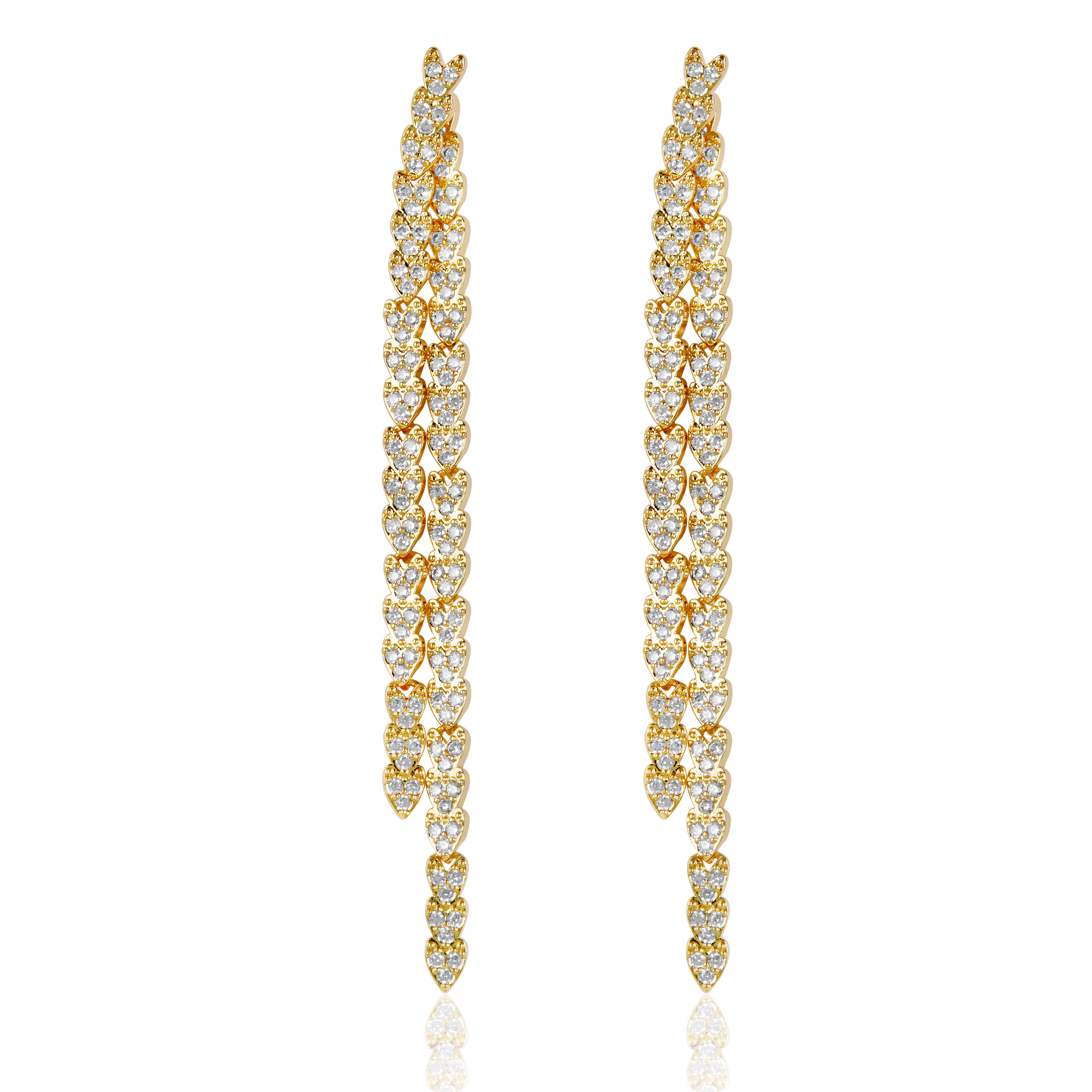 Gold reversible strand earrings, Two-strand gold crystal embellished earrings, Front and back wearable gold earrings, Sleek polished gold earrings with crystal detail, Trendsetting gold earrings as seen on Tess Daly, Modern gold earrings with playful sparkle, Elegant gold earrings with shimmering strands