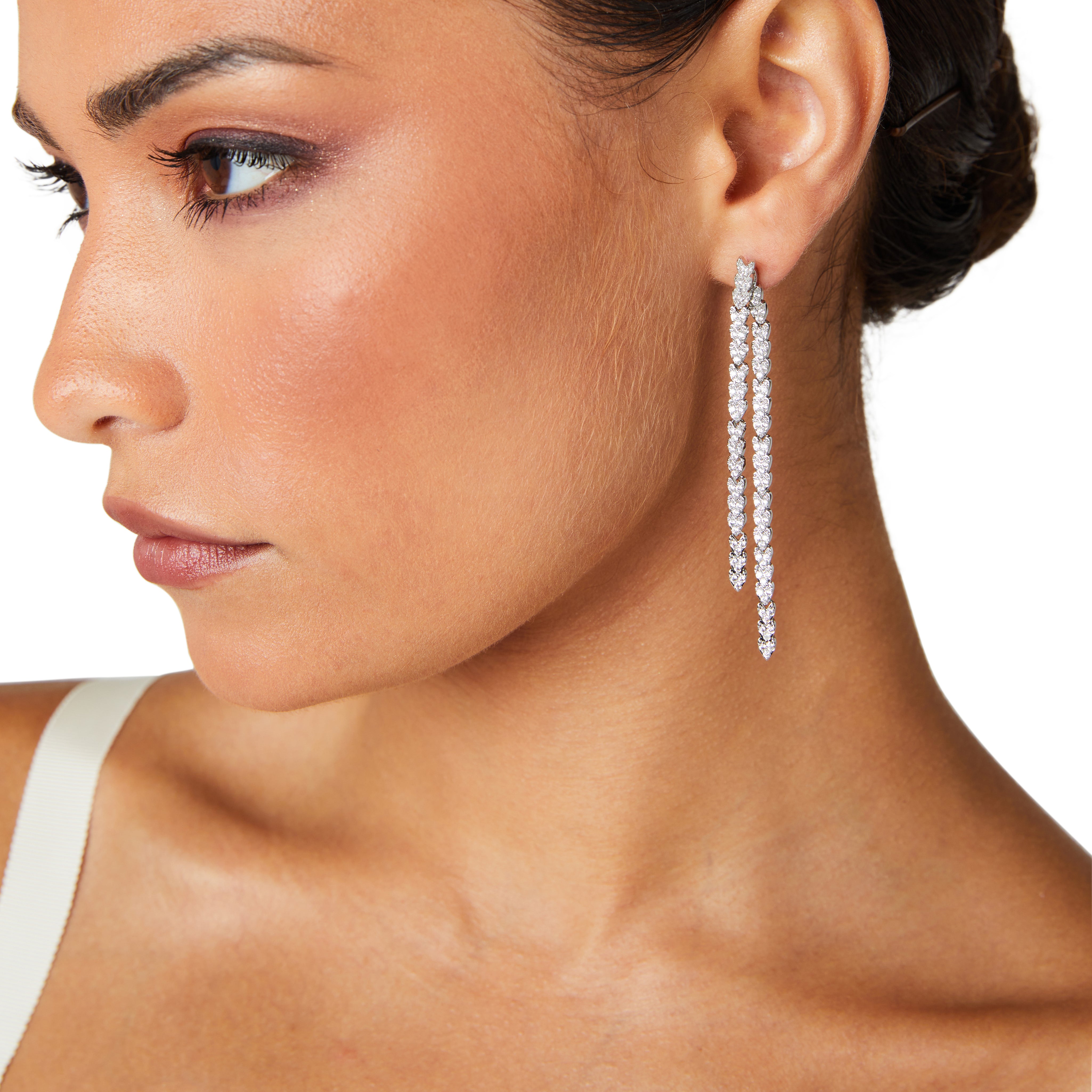 Crystal embellished reversible strand earrings, Long and short crystal strand earrings, Trendsetting front-back earring design, Double strand crystal earrings with sleek finish, As seen on Tess Daly BBC Strictly earrings, Modern reversible crystal shimmer earrings, Playful sparkling crystal earrings