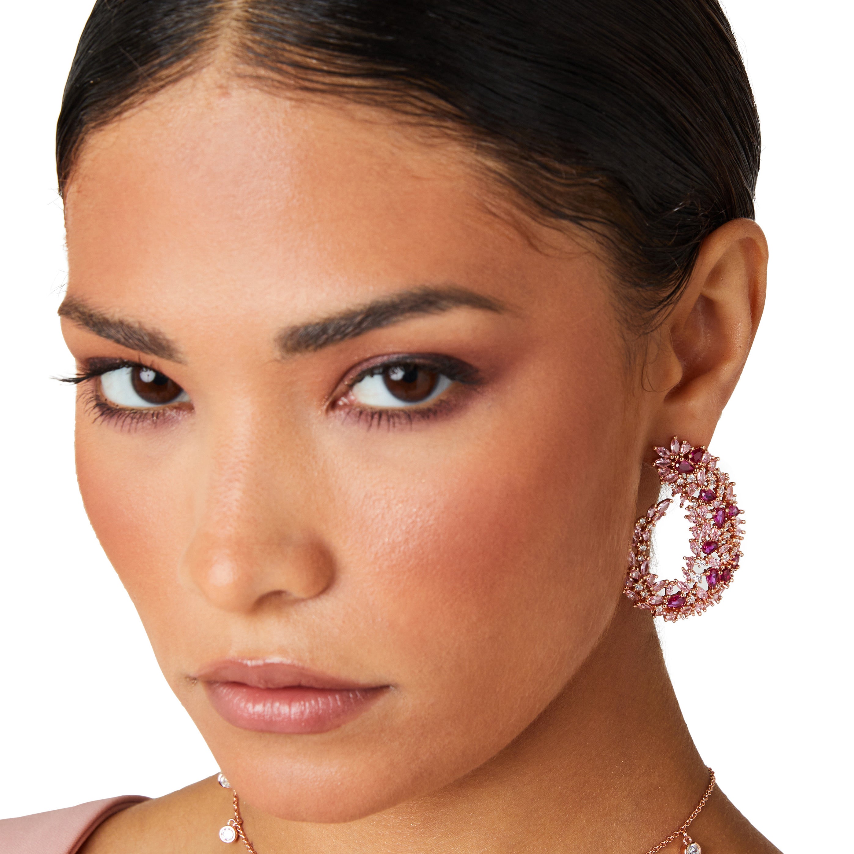 Rose gold drop earrings inspired by Japanese cherry blossoms, featuring marquise pink crystals and a sleek, curvy design for elegant statement style.