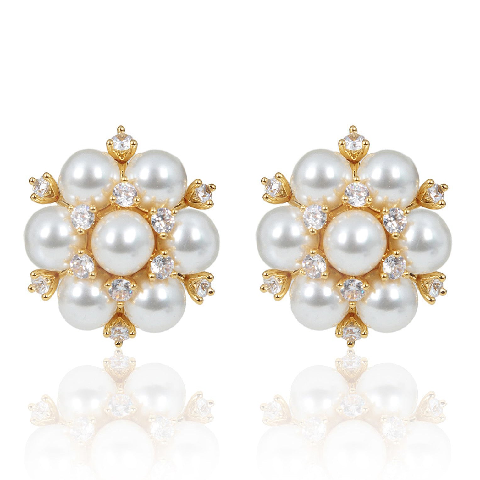Golden cluster earrings with white pearls and cubic zirconia stones, elegant day-to-night statement jewelry with warm sun-kissed tones.