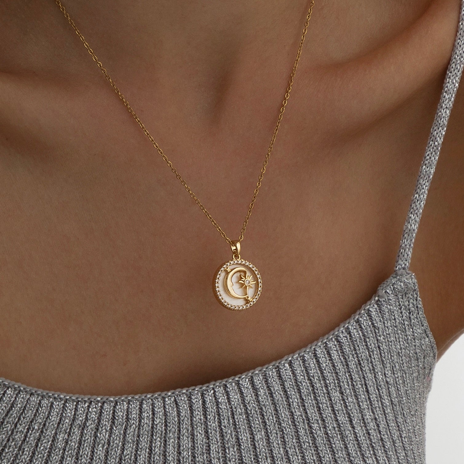 Gold pendant necklace featuring a polished crescent moon charm on a delicate chain, part of the Illuminate Collection by Valentina Rose.