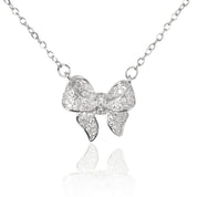 Sterling silver plated bow pendant necklace – delicate ribbon design on fine chain against white background
