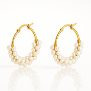 Elegant gold hoop earrings with luminous freshwater pearls — perfect as a bridal or anniversary gift
