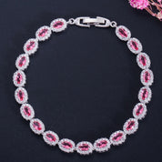 Opulence Oval Cut Halo Tennis Bracelet | Ruby Red | Silver