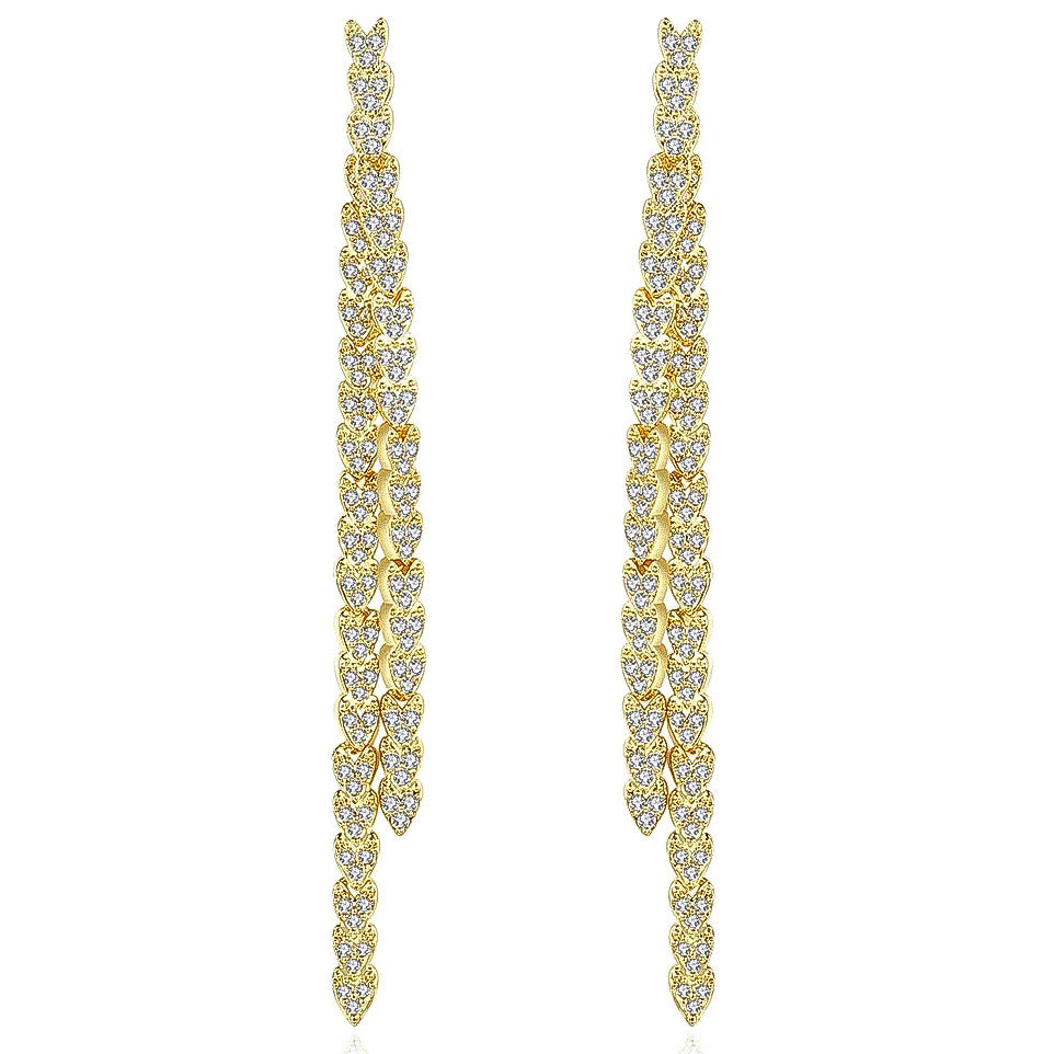 Gold reversible strand earrings, Two-strand gold crystal embellished earrings, Front and back wearable gold earrings, Sleek polished gold earrings with crystal detail, Trendsetting gold earrings as seen on Tess Daly, Modern gold earrings with playful sparkle, Elegant gold earrings with shimmering strands