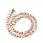 A deluxe tennis-style necklace composed of 7 mm heart-shaped clear cubic zirconia stones, each set in polished 18 ct gold plating. The hearts are aligned closely along a 16‑inch (40 cm) chain, creating a continuous sparkle around the neckline. The design features a secure, invisible clasp hidden behind one stone for a seamless look. The high-reflective gold finish and perfectly cut CZs give the piece a luxurious, radiant appeal—ideal for special occasions or elevating everyday style. It weighs approximately