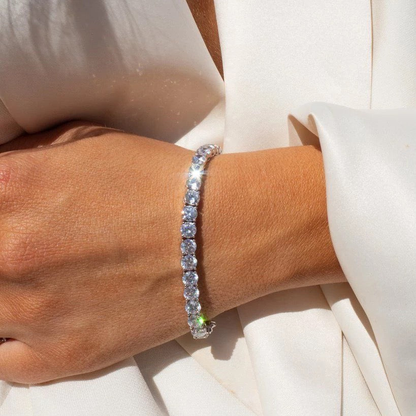 Close-up of silver tennis bracelet with sparkling cubic zirconia stones set in a delicate line