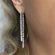 Crystal embellished reversible strand earrings, Long and short crystal strand earrings, Trendsetting front-back earring design, Double strand crystal earrings with sleek finish, As seen on Tess Daly BBC Strictly earrings, Modern reversible crystal shimmer earrings, Playful sparkling crystal earrings