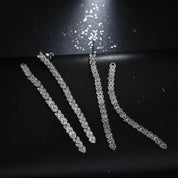 Crystal embellished reversible strand earrings, Long and short crystal strand earrings, Trendsetting front-back earring design, Double strand crystal earrings with sleek finish, As seen on Tess Daly BBC Strictly earrings, Modern reversible crystal shimmer earrings, Playful sparkling crystal earrings