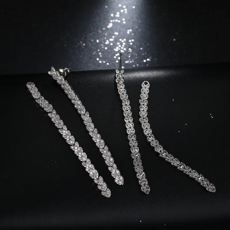 Crystal embellished reversible strand earrings, Long and short crystal strand earrings, Trendsetting front-back earring design, Double strand crystal earrings with sleek finish, As seen on Tess Daly BBC Strictly earrings, Modern reversible crystal shimmer earrings, Playful sparkling crystal earrings