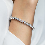 Model wearing silver deluxe tennis bracelet – elegant sparkle adds glamour to evening look