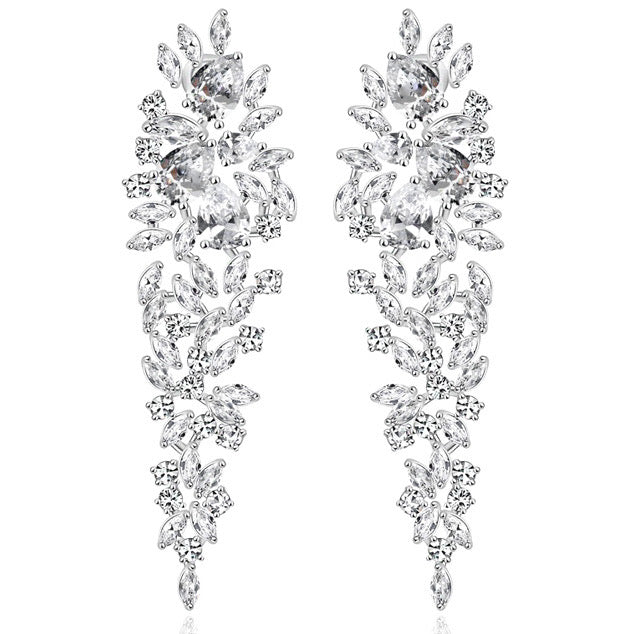 Starlet Supreme earrings, silver drop earrings, long statement earrings, geometric cubic zirconia, sparkling detail, worn by Tess Daly, BBC Strictly Come Dancing, model wearing earrings, evening jewelry, special occasion earrings, elegant design, party earrings, wedding guest jewelry, red carpet style