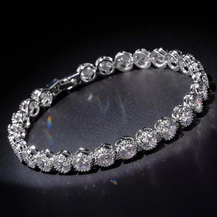 Dainty rhodium-plated tennis bracelet with sparkling 3A cubic zirconia stones in bezel setting, slim 4-5mm width, available in 17cm, 19cm, and 20cm lengths, lightweight and elegant for everyday wear, nickel free, presented in Valentina-Rose gift box.