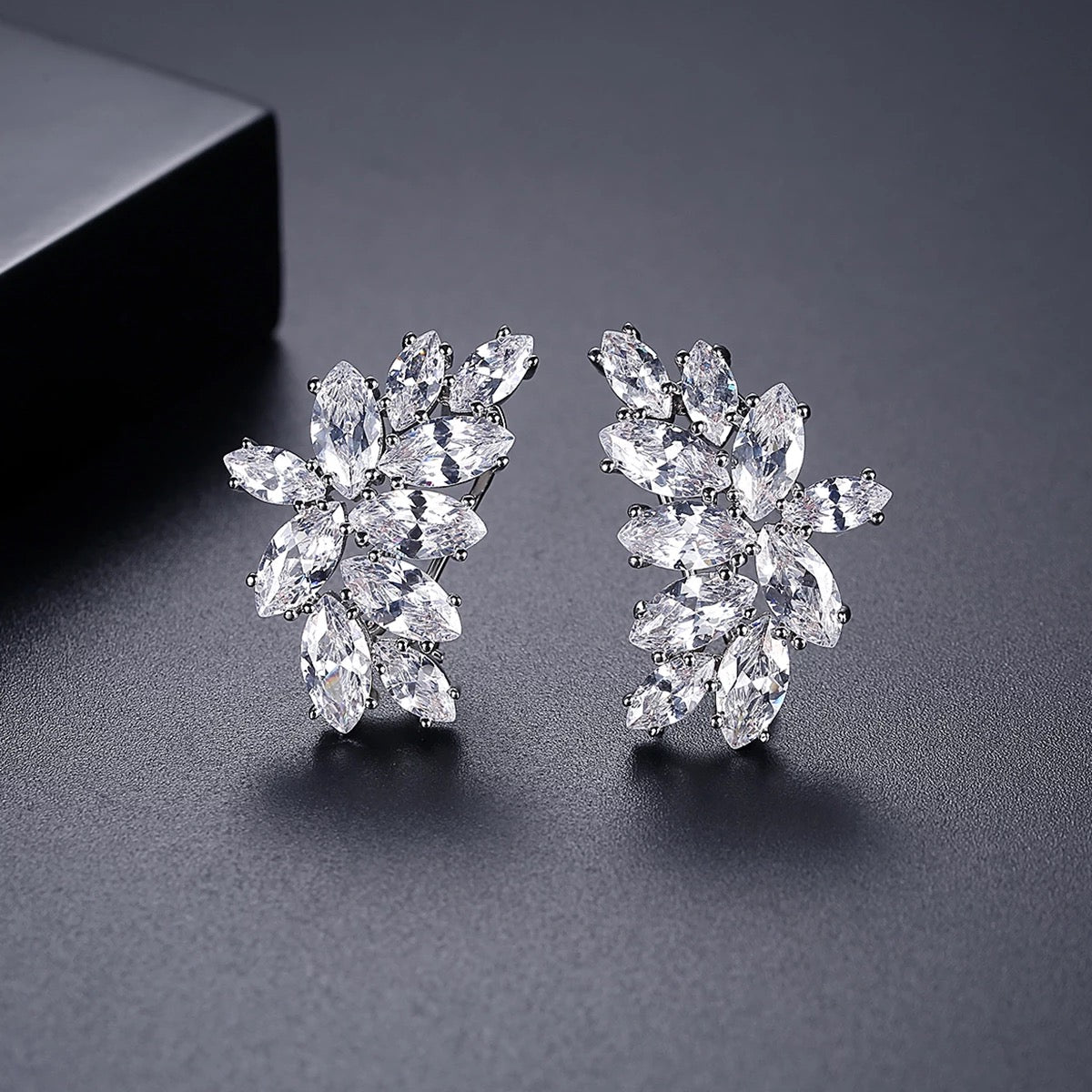 Silver Meghan Cluster Earrings with marquise-cut crystals arranged in an elegant floral cluster, perfect for special occasions or gifting