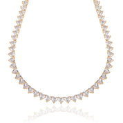 A deluxe tennis-style necklace composed of 7 mm heart-shaped clear cubic zirconia stones, each set in polished 18 ct gold plating. The hearts are aligned closely along a 16‑inch (40 cm) chain, creating a continuous sparkle around the neckline. The design features a secure, invisible clasp hidden behind one stone for a seamless look. The high-reflective gold finish and perfectly cut CZs give the piece a luxurious, radiant appeal—ideal for special occasions or elevating everyday style. It weighs approximately