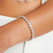 Crystal bezel set tennis bracelet on a model 