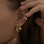 Gold earrings featuring a crescent moon and star design with a polished finish, from the Illuminate Collection by Valentina Rose.