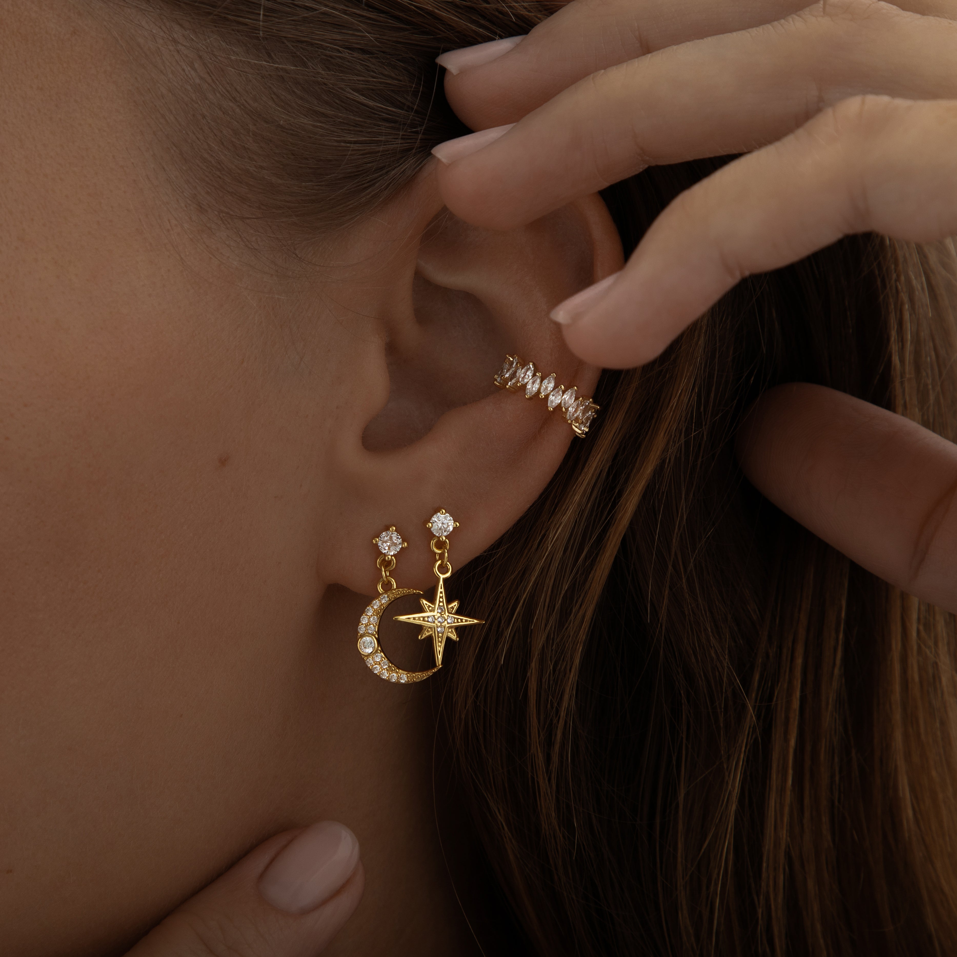 Gold earrings featuring a crescent moon and star design with a polished finish, from the Illuminate Collection by Valentina Rose.