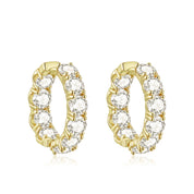 Gold hoop earrings with clear gemstones on a white background