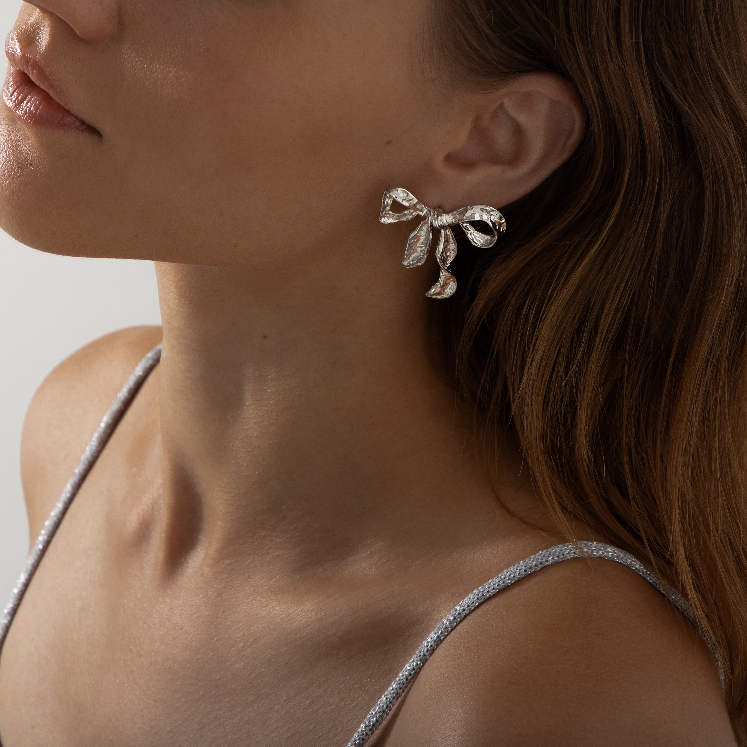 Ribbon Twist Hammered Bow Earrings | Silver
