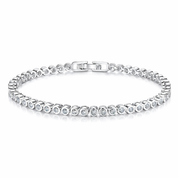 Silver bezel set tennis bracelet with clear stones on a white background