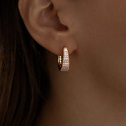 Rose gold huggie hoop earrings with pavé cubic zirconia, gently domed and polished for subtle sparkle. Medium-small size (1.7cm), shown in eco-friendly Valentina Rose gift box.
