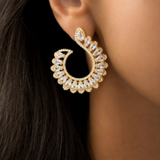 Gold and crystal statement earring worn by Valentina-Rose model 