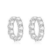 Pair of silver hoop earrings with clear gemstones on a white background