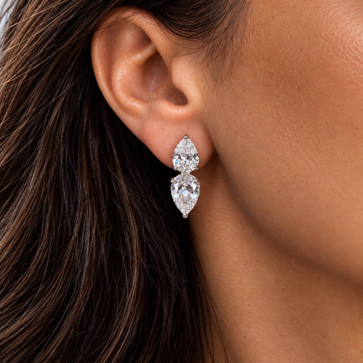 Model wearing silver double pear-cut statement stud earrings with clear cubic zirconia – Valentina-Rose