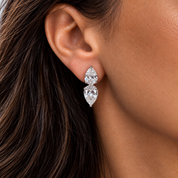 Model wearing silver double pear-cut statement stud earrings with clear cubic zirconia – Valentina-Rose