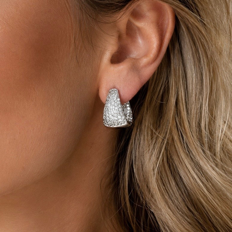 Valentina-Rose model wearing a sparkling silver pave hoop  earring.