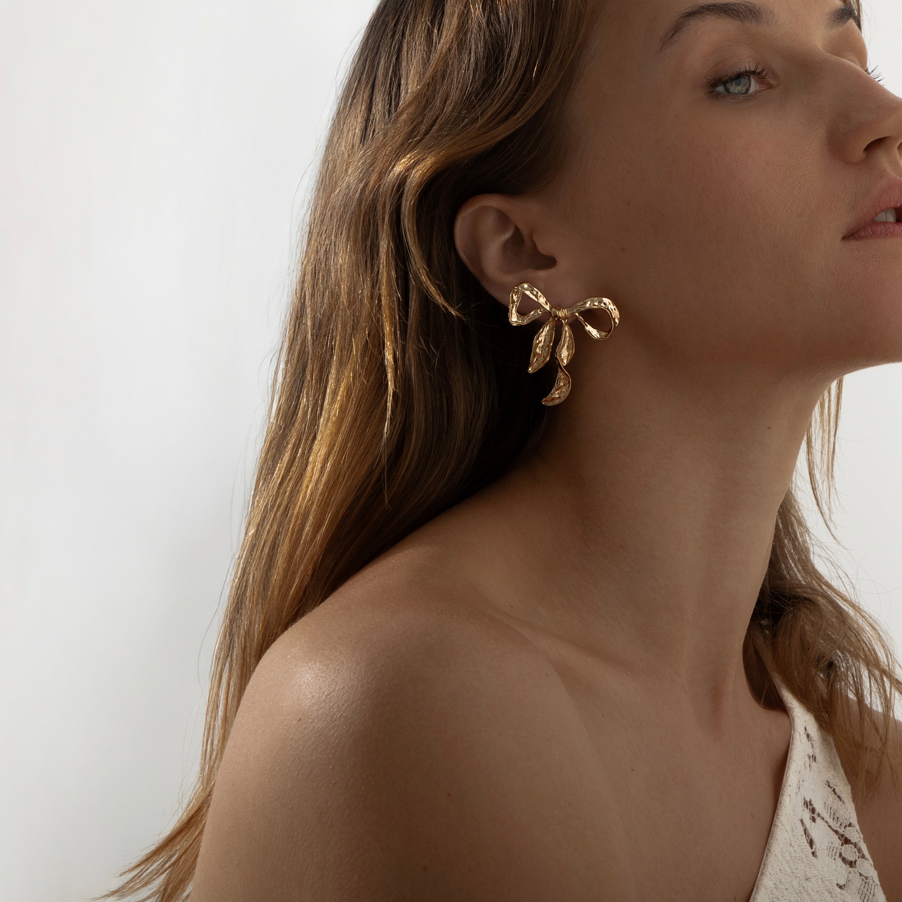 Ribbon Twist Hammered Bow Earrings | Gold