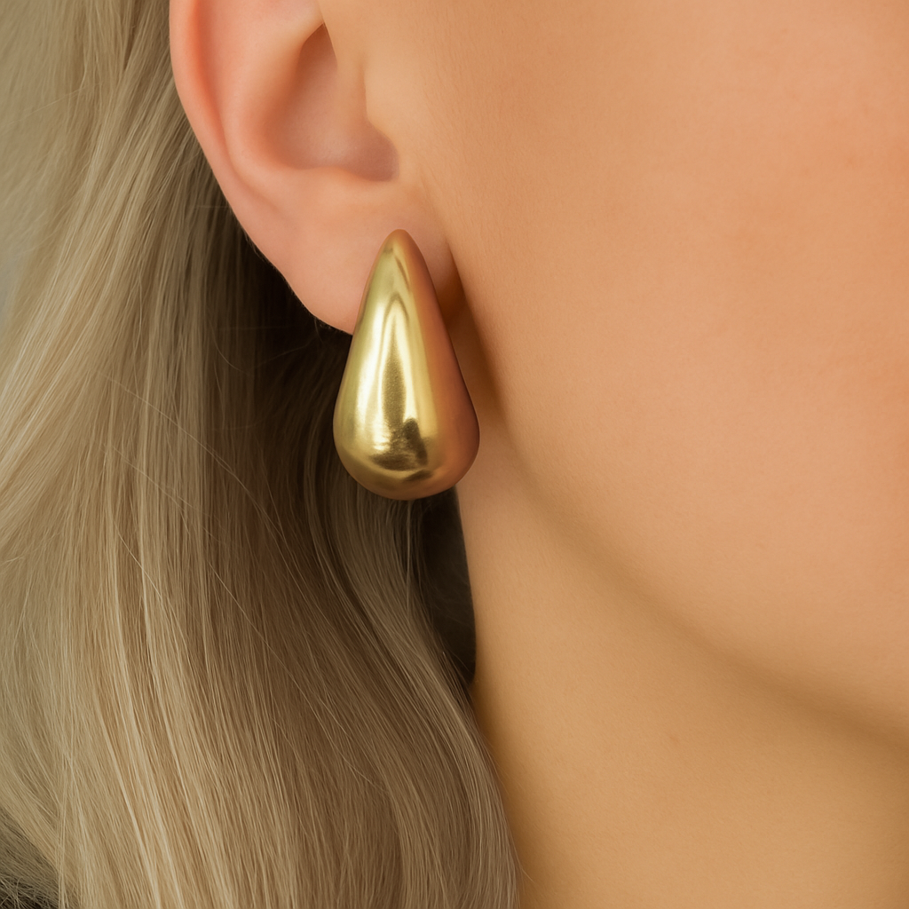 18k gold-plated brass with smooth polished finish, Teardrop gold earrings with sculptural Greek-inspired design, Elegant gold earrings with a minimal teardrop silhouette, Smooth polished gold earrings, modern yet timeless style, Gold-plated brass earrings with a goddess-inspired teardrop shape