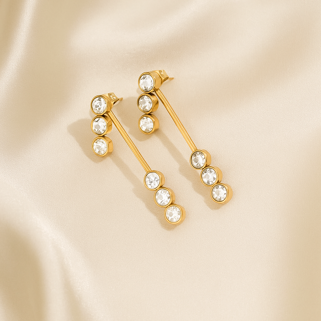Gold front-to-back drop earrings with a minimalist linear design and high-polish finish, part of the Illuminate Collection by Valentina Rose.