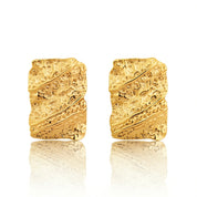 Bold gold molten statement earrings with organic, fluid texture inspired by ocean waves
