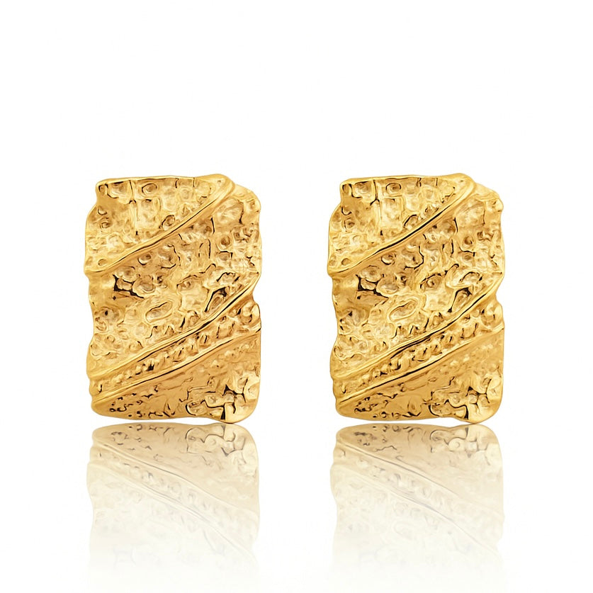 Bold gold molten statement earrings with organic, fluid texture inspired by ocean waves
