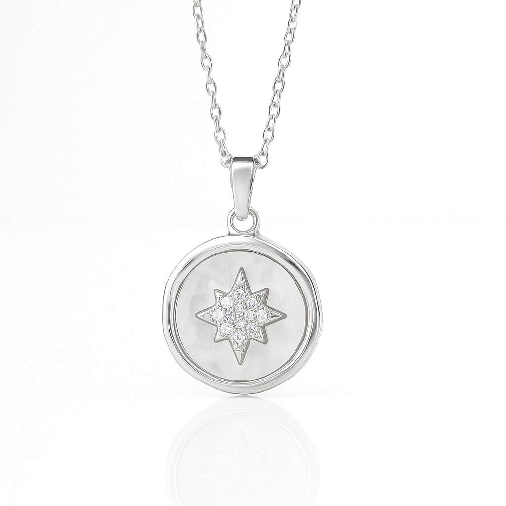 Silver necklace with a star-shaped pendant on a white background