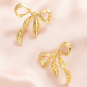 Ribbon Twist Hammered Bow Earrings | Gold