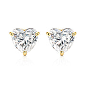Heart-shaped diamond stud earrings with gold prongs on a white background