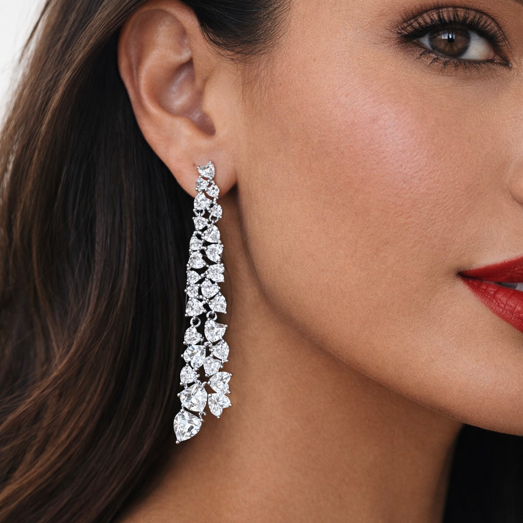 Pair of long, heart shaped diamond earrings 