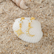 Gold earrings featuring a crescent moon and star design with a polished finish, from the Illuminate Collection by Valentina Rose.