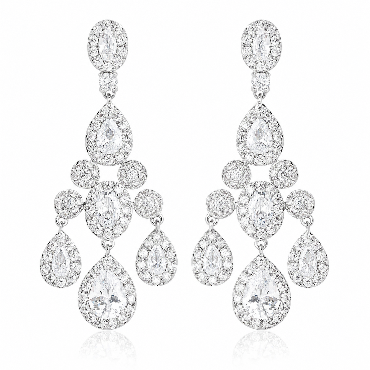Pair of silver chandelier statement earrings on a white background