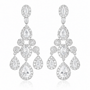 Pair of silver chandelier statement earrings on a white background