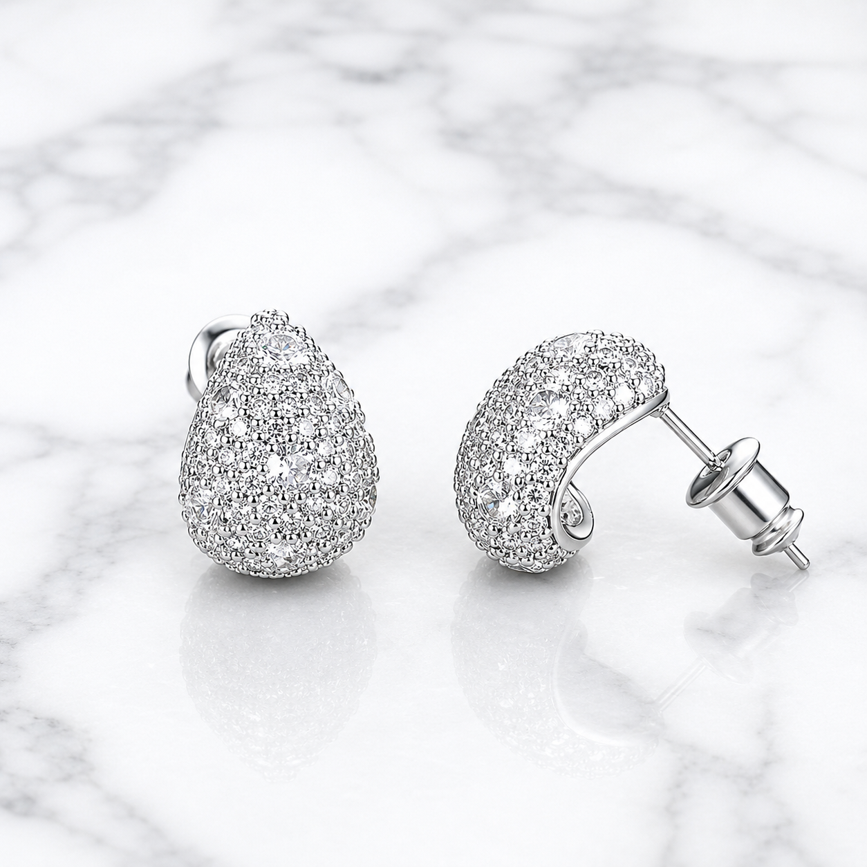 Close-up of silver pavé teardrop stud earrings with cubic zirconia – Valentina-Rose