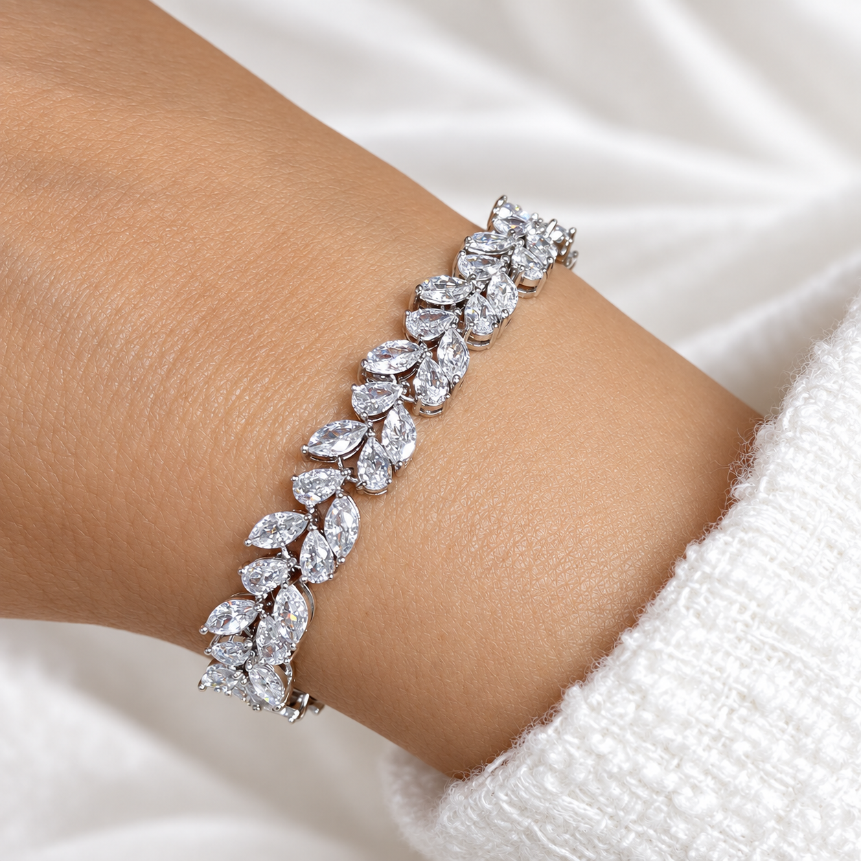 Silver vine leaf crystal tennis bracelet worn on the wrist, showing the sparkling marquise-cut stone design – Valentina-Rose